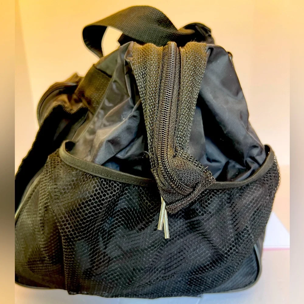 Stylish Vintage Dark Black Duffel Bag with Many Pockets.   New without Tags.